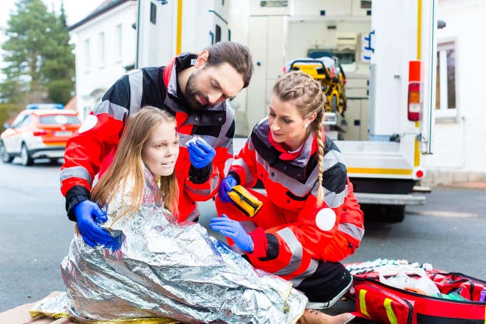 Paramedics Helping An Injured Girl after she got into a car accident in Castle Rock